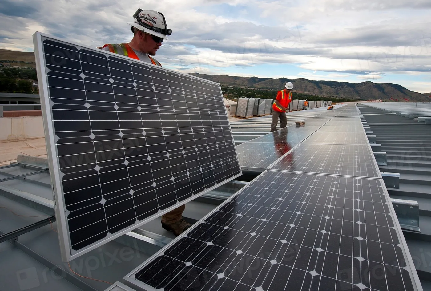 Technician installing solar photovoltaic panels